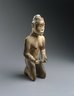 Kneeling Woman Holding a Pipe
