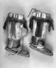 Pair of Boots with tassels at the front and back and drawstring tops