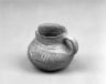 Small Coiled Pitcher with black on white unslipped striped design