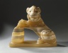 Brooklyn Museum: Lion Holding Vessel