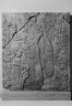 Relief of Winged Man-Headed Figure Facing Right with Basket and Fircone