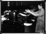 [Untitled]  (Close-up of Woman at Cotton Machine Barrels)
