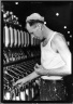 [Untitled] (Man in Cap Holding Thread)