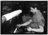 [Untitled] (Man Seated at Cylinder)