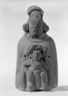 Woman Sheltering a Man (Rattle)