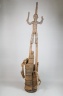 Figure of a Male Stilt Dancer Holding Knife and Horn