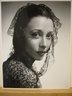 [Untitled]  (Brunette Woman Wearing Black Lace Shawl on Head and Shoulders)