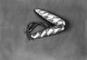 Two Arrow-shaped Fish Lures attached by leather strips