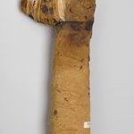 Mummy of a Dog (or Canine Animal) Wrapped in Linen with Elaborate Head Molded in the Shape of Dog Head with Painted Details