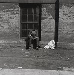 Man Sleeping in Window
