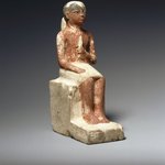 Statuette of Seated Man Clasping a Lotus Blossom