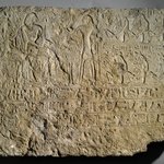 Relief of Khamwasemen and His Wife Seated at the Table of Offerings with Standing Priest