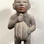 Man Carrying a Cacao Pod