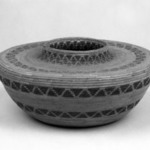 Coiled Basket with Flat Shoulders and Short Straight Neck decorated with bands of triangles