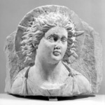 Head of Helios in High Relief Against a Pedimental Background