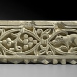 Plant Scroll Enclosing Grapes and an Animal