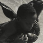 [Untitled] (Boy on Rubber Dolphin)