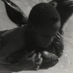 [Untitled] (Boy on Rubber Dolphin)