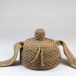 Cap With Topknot and Side Extensions