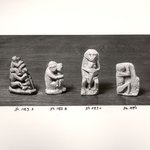 Small Monkey in Sitting Position with Upraised Arms