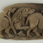 Charred Fragment of a Panel with Animal Scene in Bold Relief