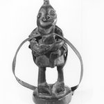 Figure Holding a Flute