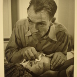 [Untitled] (Dr. Ernest Ceriani Swabbing Eye of Child)